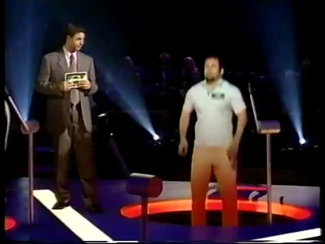 Contestant drops through floor as Mark L Walberg hosts Russian Roulette