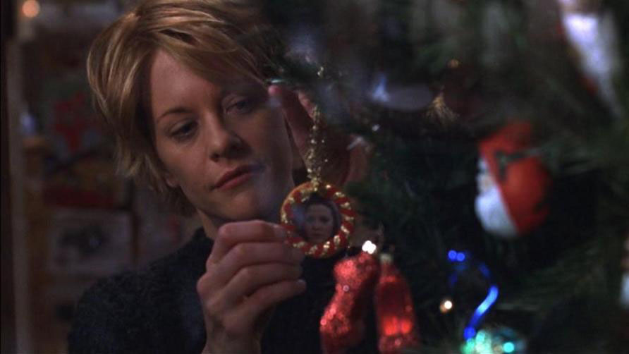 Meg Ryan hanging a Christmas ornament in You’ve Got Mail