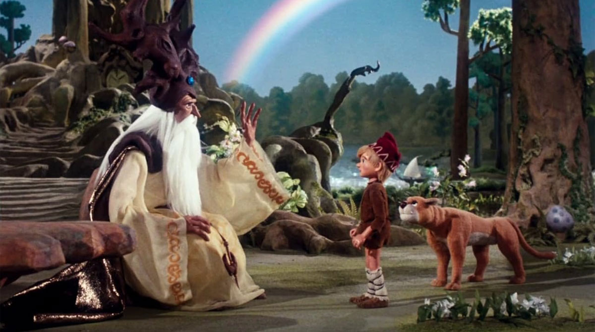 Young Santa surrounded by woodland creatures in The Life and Adventures of Santa Claus