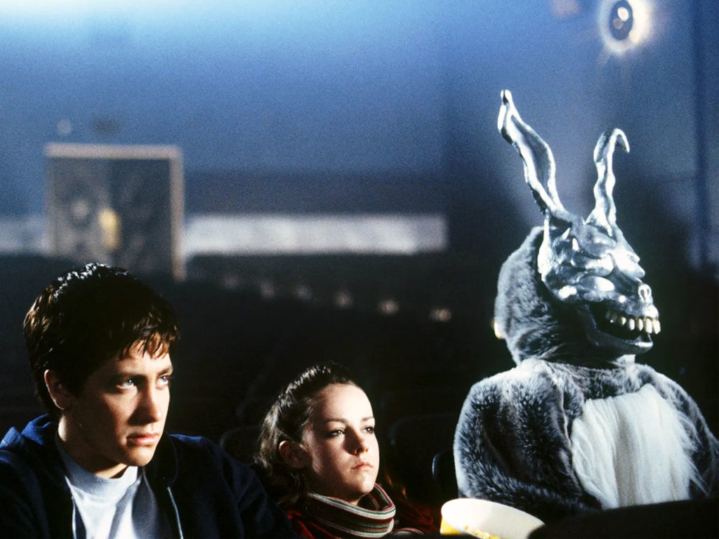 Jake Gyllenhaal as Donnie sitting in a theater in Donnie Darko.psd