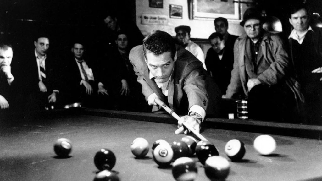 Underrated 1960s Movies - Paul Newman preparing a shot at the pool table in The Hustler
