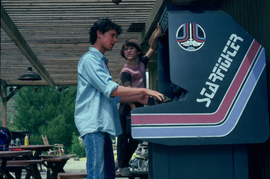 Alex Rogan at the Starfighter arcade cabinet in The Last Starfighter (1984)