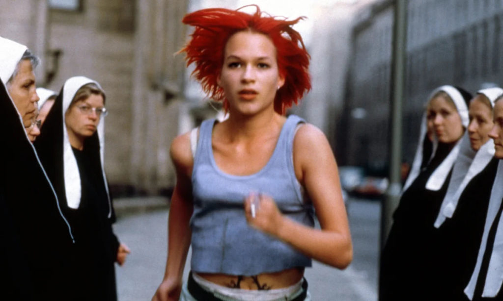 Franka Potente as Lola sprinting through Berlin in Run Lola Run (1998)