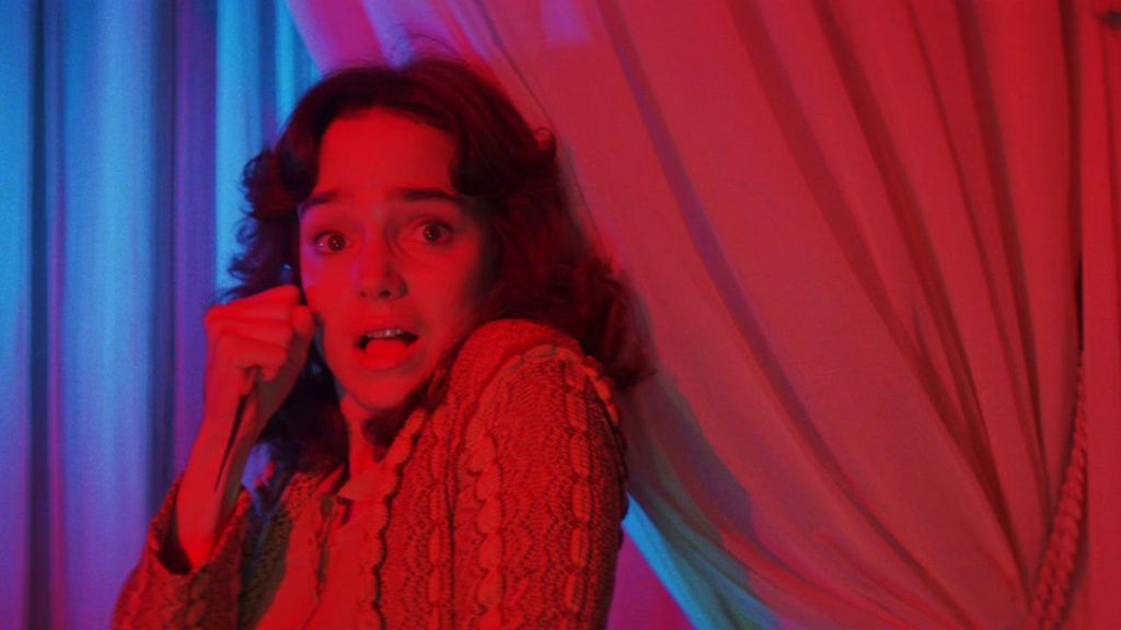 Jessica Harper in a vivid red-lit scene from Suspiria (1977)