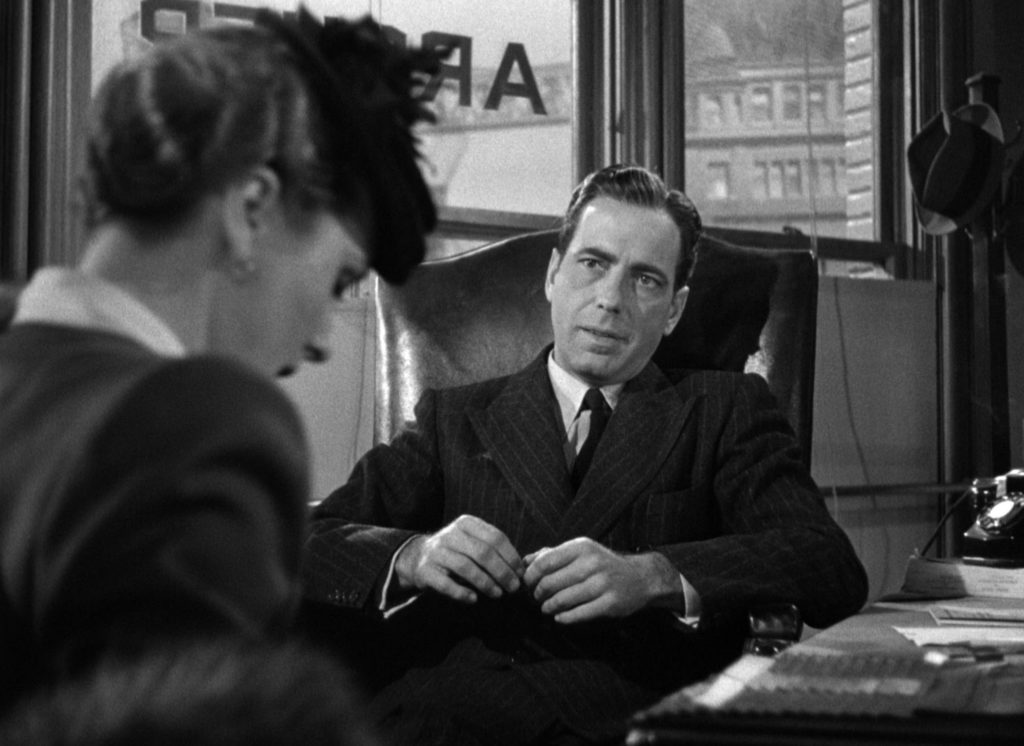 Why Film Noir Had to End and What Replaced It - Humphrey Bogart in a shadowy office in The Maltese Falcon