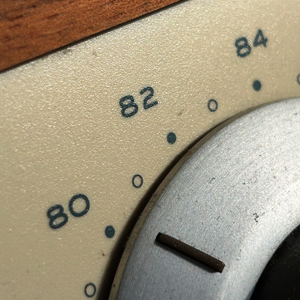 Why UHF Channels Mattered- How the Second Dial Built Cult TV - A close-up of a vintage television cabinet showing the dual tuning knobs for VHF and UHF channels
