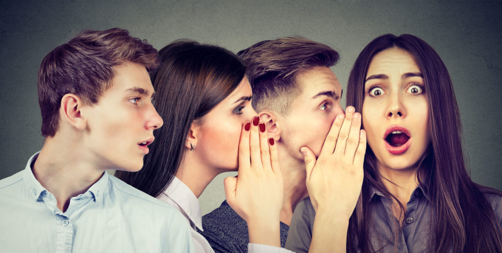 How to play the Telephone Game - A line of people whispering during the Telephone Game